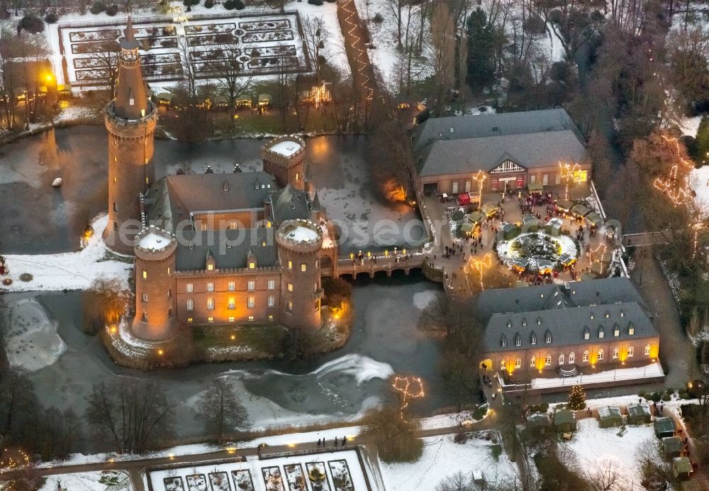 Bedburg-Hau at night from above - Night lighting building and castle park systems of water castle Moyland in the district Till-Moyland in Bedburg-Hau in the state North Rhine-Westphalia, Germany