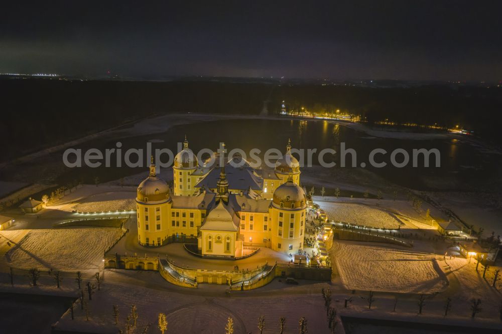 Moritzburg at night from above - Night lights and illumination Christmas market at the hunting and moated castle in the castle pond in Moritzburg in the federal state of Saxony, Germany