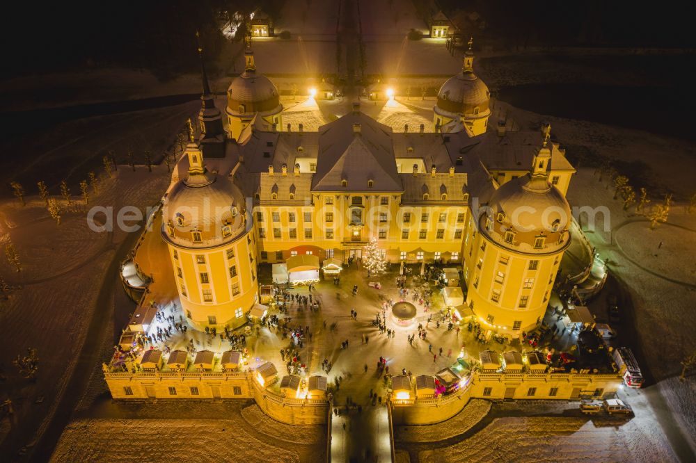 Moritzburg at night from above - Night lights and illumination Christmas market at the hunting and moated castle in the castle pond in Moritzburg in the federal state of Saxony, Germany