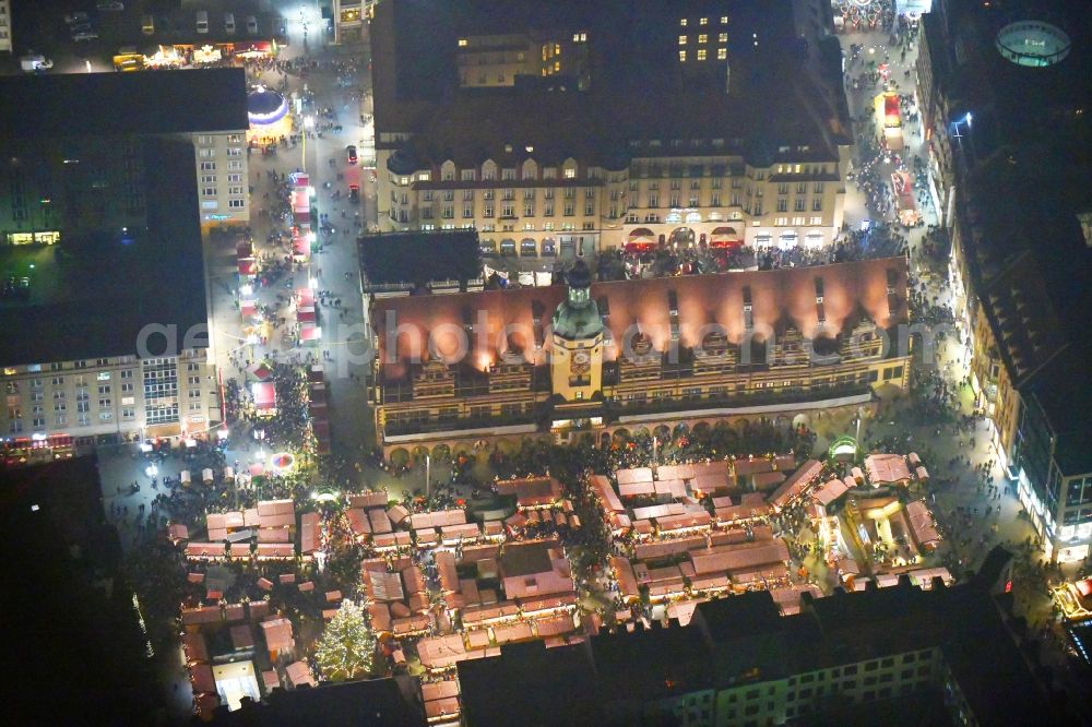 Aerial photograph at night Leipzig - Night lighting christmas market on Town Hall building of the City Council at the market downtown in the district Zentrum in Leipzig in the state Saxony, Germany