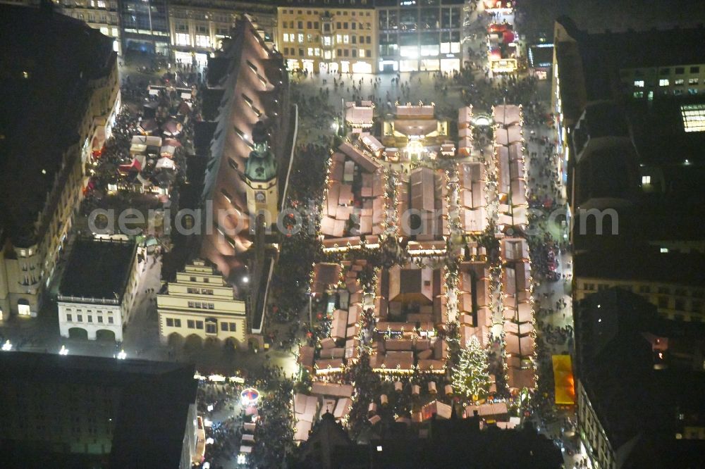 Aerial photograph at night Leipzig - Night lighting christmas market on Town Hall building of the City Council at the market downtown in the district Zentrum in Leipzig in the state Saxony, Germany