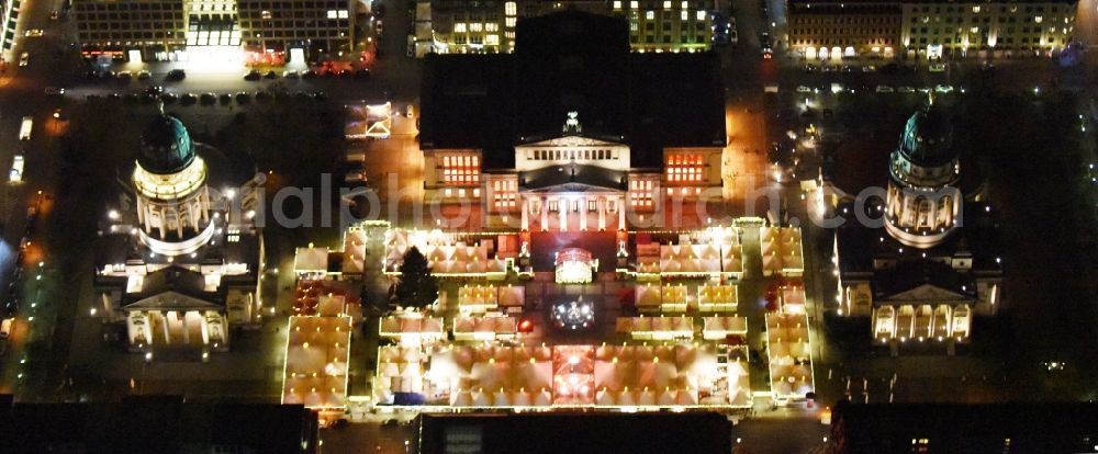 Berlin at night from the bird perspective: Night view christmas market on place area Gendarmenmarkt with the building ensemble German and French Cathedral, Schauspielhaus in Berlin Mitte