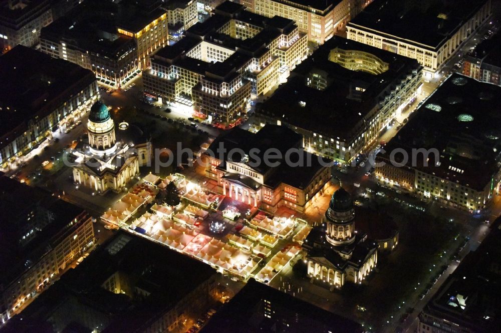 Aerial photograph at night Berlin - Night view christmas market on place area Gendarmenmarkt with the building ensemble German and French Cathedral, Schauspielhaus in Berlin Mitte