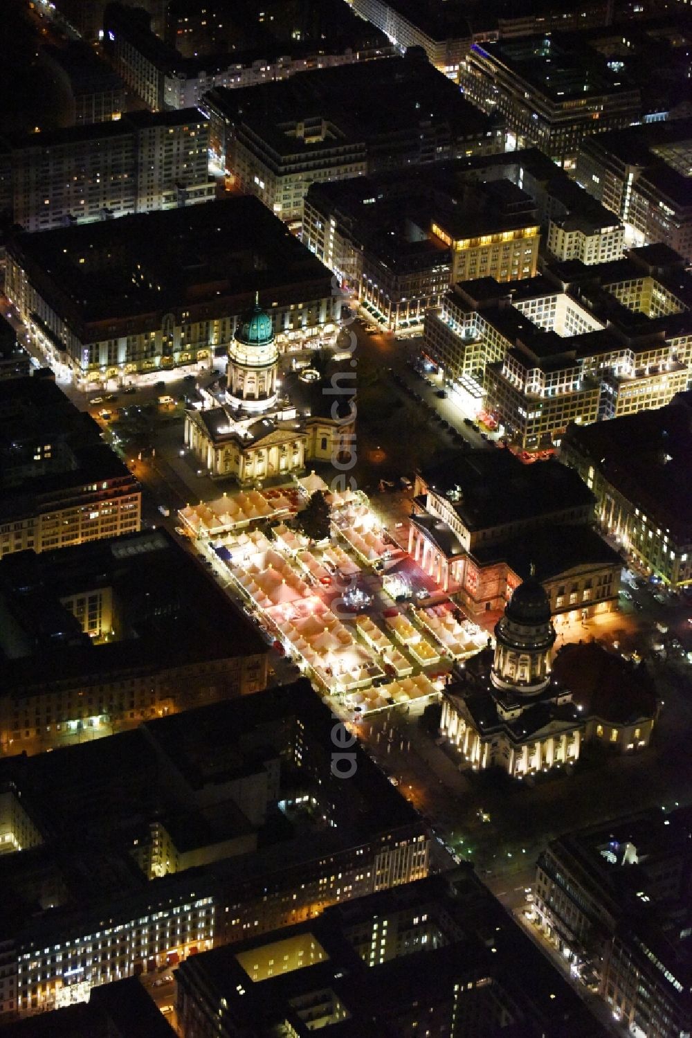 Aerial image at night Berlin - Night view christmas market on place area Gendarmenmarkt with the building ensemble German and French Cathedral, Schauspielhaus in Berlin Mitte