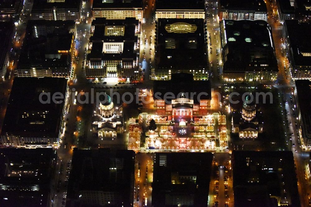 Berlin at night from the bird perspective: Night view christmas market on place area Gendarmenmarkt with the building ensemble German and French Cathedral, Schauspielhaus in Berlin Mitte