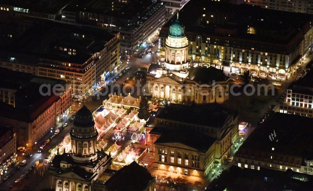 Berlin at night from the bird perspective: Night view christmas market on place area Gendarmenmarkt with the building ensemble German and French Cathedral, Schauspielhaus in Berlin Mitte