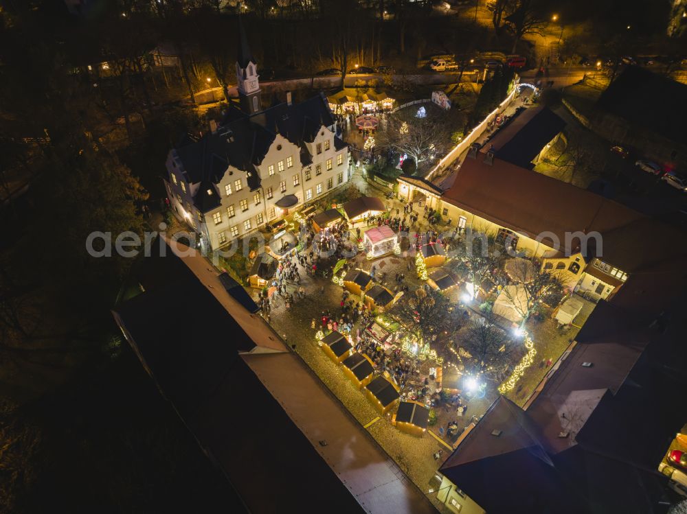 Aerial image at night Freital - Night lighting christmas market in the inner courtyard of Burgk Castle on Altburgk Street in the Burgk district of Freital in the state of Saxony, Germany