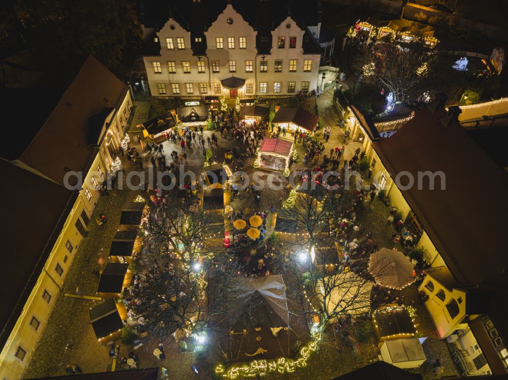 Aerial image at night Freital - Night lighting christmas market in the inner courtyard of Burgk Castle on Altburgk Street in the Burgk district of Freital in the state of Saxony, Germany