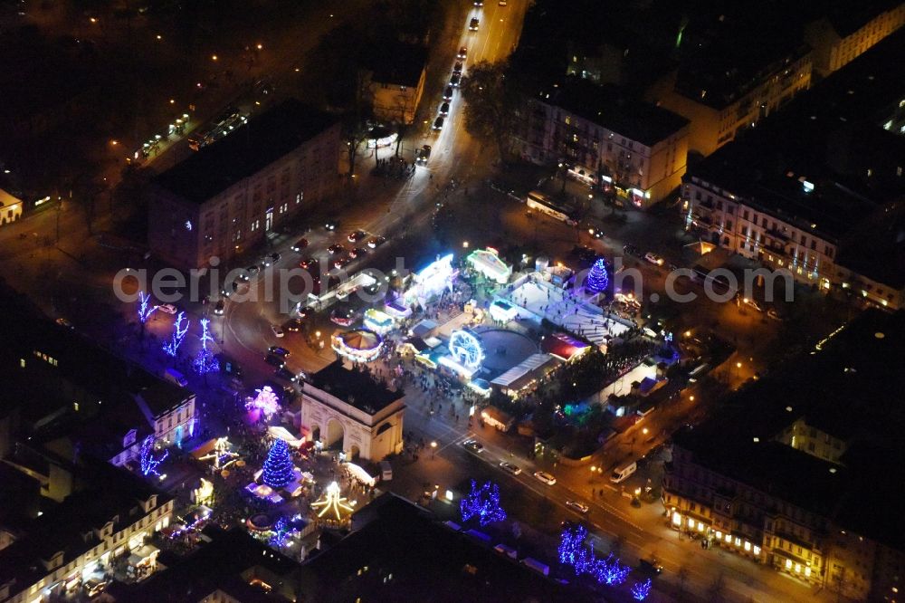 Aerial image at night Potsdam - Night lights of Christmas - event site Luisenplatz on place Brandenburger Tor in Potsdam in the state Brandenburg