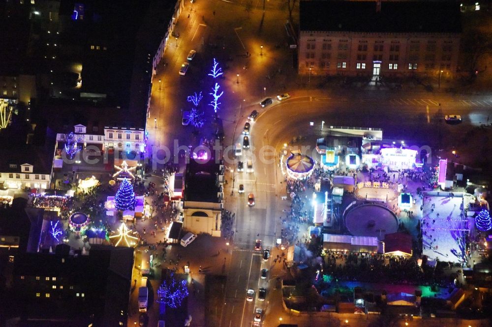 Aerial photograph at night Potsdam - Night lights of Christmas - event site Luisenplatz on place Brandenburger Tor in Potsdam in the state Brandenburg