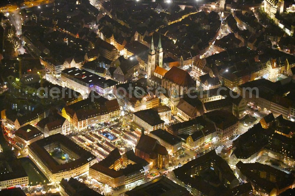 Nürnberg at night from above - Night lighting Christmassy market event grounds and sale huts and booths on Platz of Nuernberger Hauptmarkt in Nuremberg in the state Bavaria, Germany