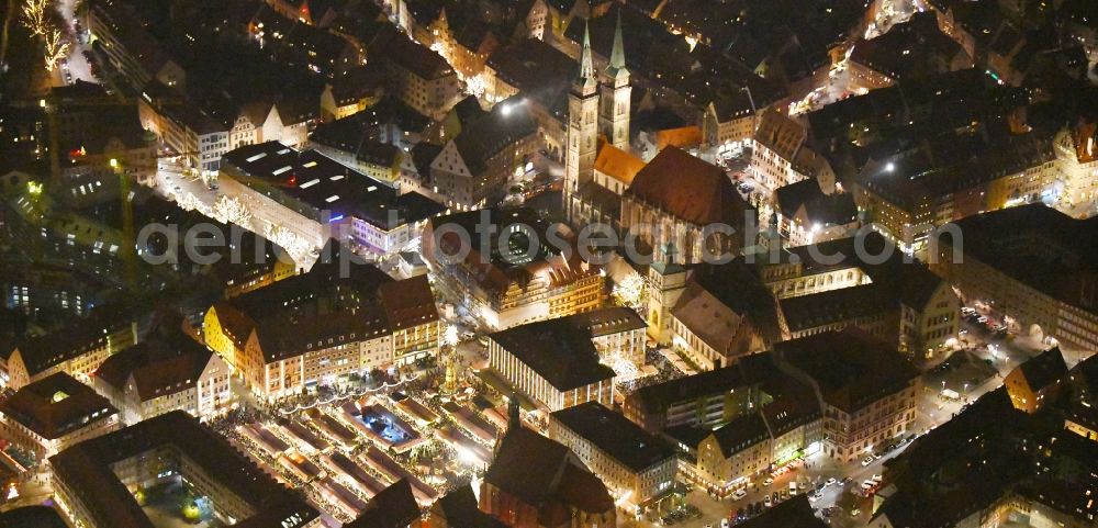 Aerial photograph at night Nürnberg - Night lighting Christmassy market event grounds and sale huts and booths on Platz of Nuernberger Hauptmarkt in Nuremberg in the state Bavaria, Germany