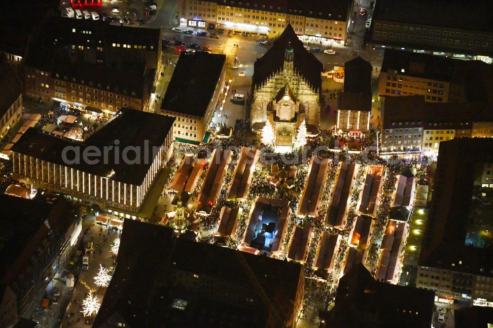 Aerial photograph at night Nürnberg - Night lighting Christmassy market event grounds and sale huts and booths on Platz of Nuernberger Hauptmarkt in Nuremberg in the state Bavaria, Germany