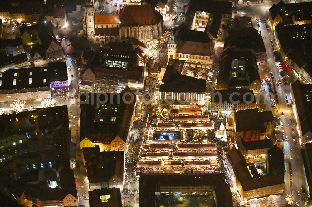 Aerial photograph at night Nürnberg - Night lighting Christmassy market event grounds and sale huts and booths on Platz of Nuernberger Hauptmarkt in Nuremberg in the state Bavaria, Germany