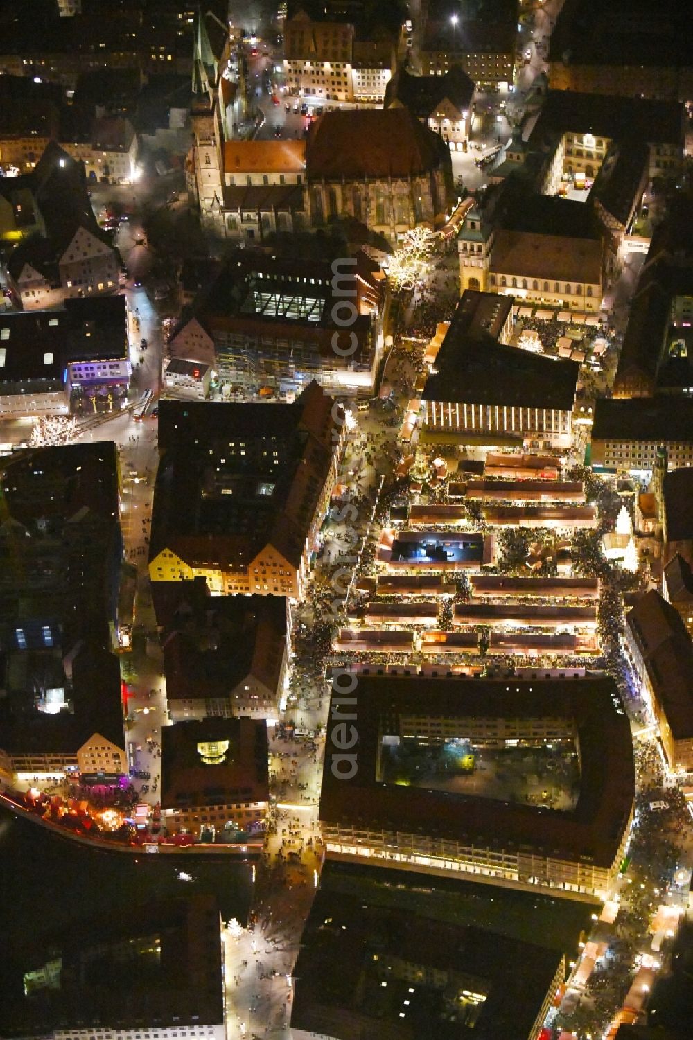 Aerial image at night Nürnberg - Night lighting Christmassy market event grounds and sale huts and booths on Platz of Nuernberger Hauptmarkt in Nuremberg in the state Bavaria, Germany