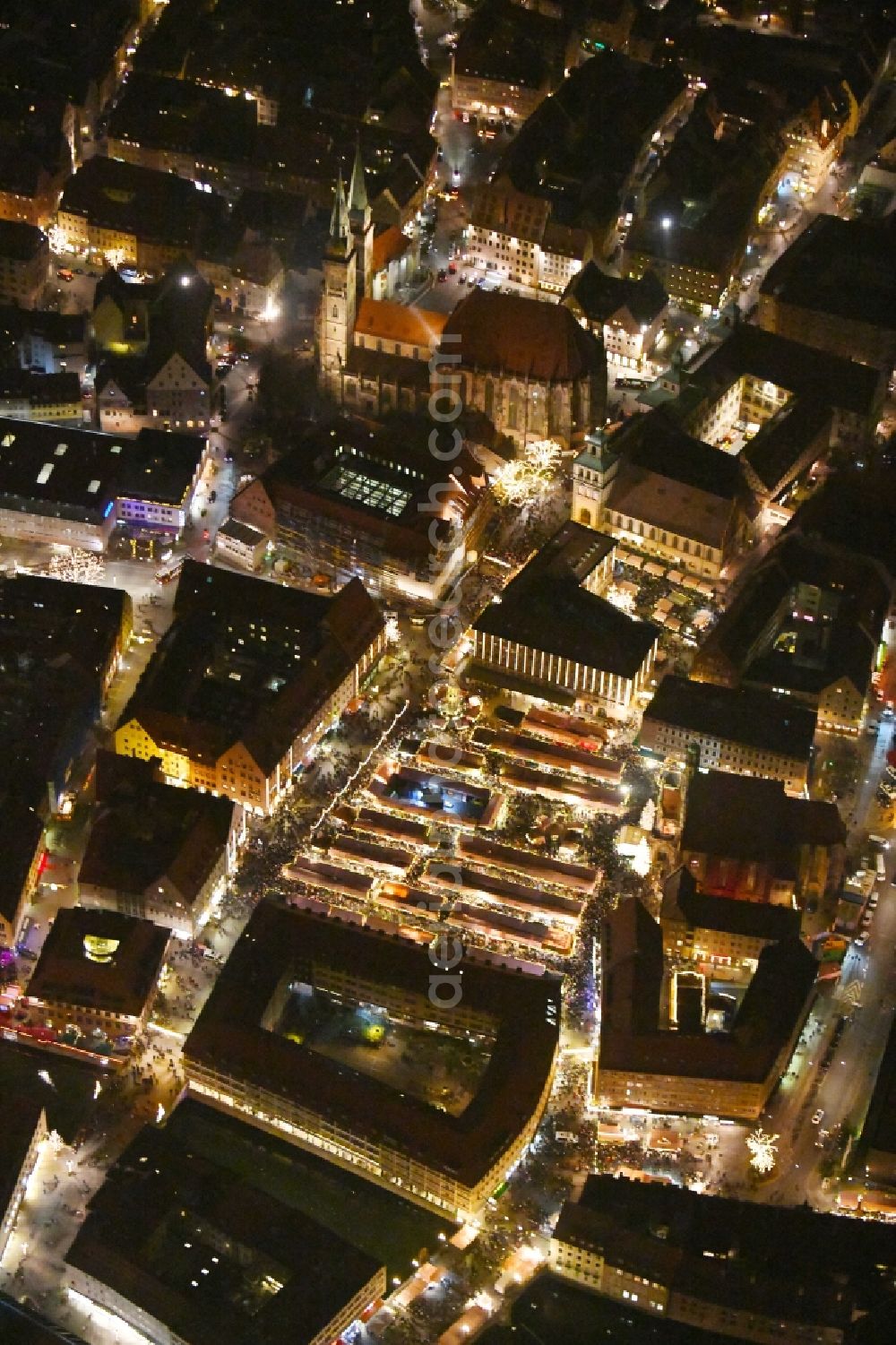 Nürnberg at night from above - Night lighting Christmassy market event grounds and sale huts and booths on Platz of Nuernberger Hauptmarkt in Nuremberg in the state Bavaria, Germany