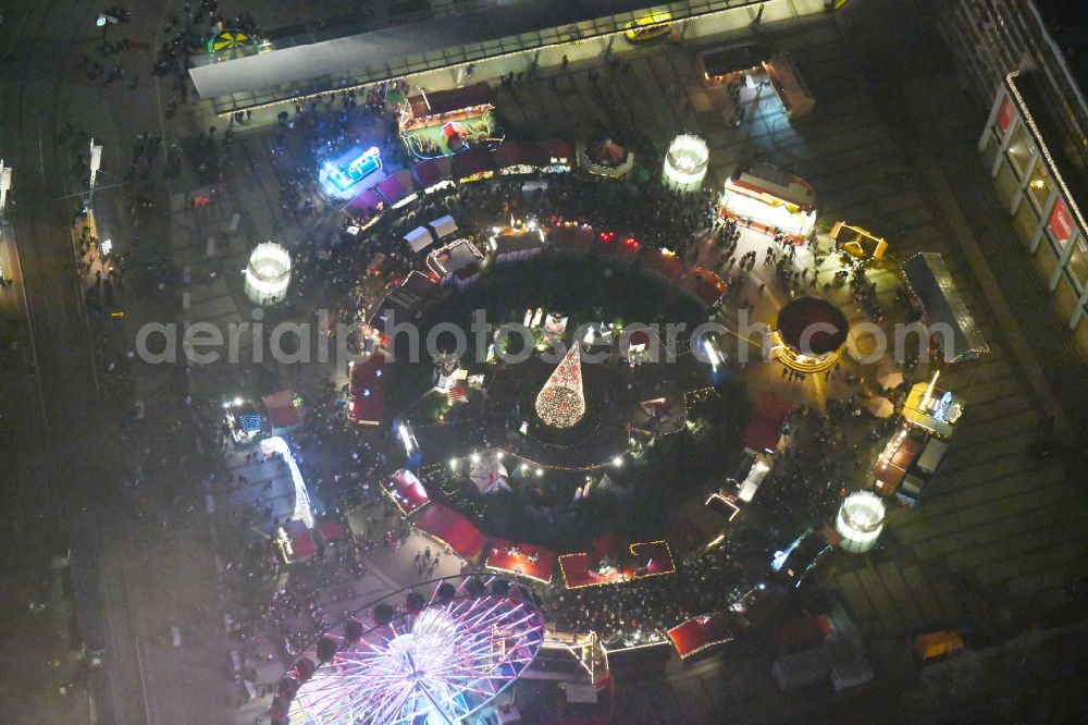 Aerial image at night Leipzig - Night lighting Christmassy market event grounds and sale huts and booths on Augustusplatz in Leipzig in the state Saxony, Germany