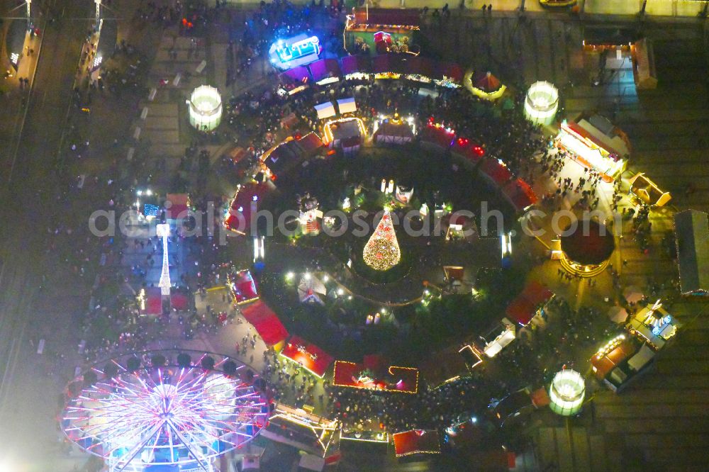 Leipzig at night from above - Night lighting Christmassy market event grounds and sale huts and booths on Augustusplatz in Leipzig in the state Saxony, Germany