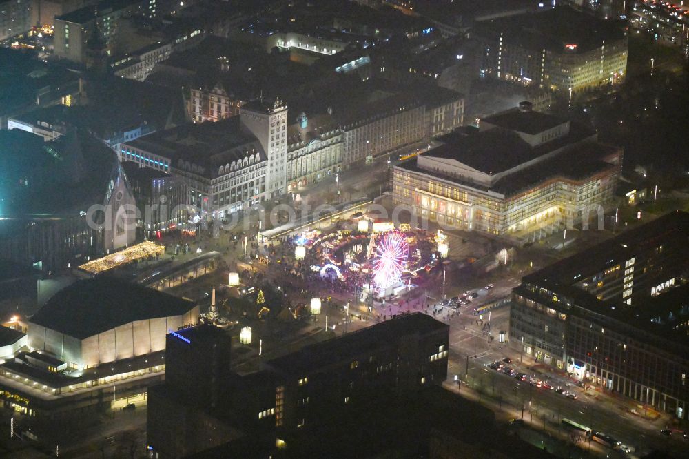 Leipzig at night from above - Night lighting Christmassy market event grounds and sale huts and booths on Augustusplatz in Leipzig in the state Saxony, Germany