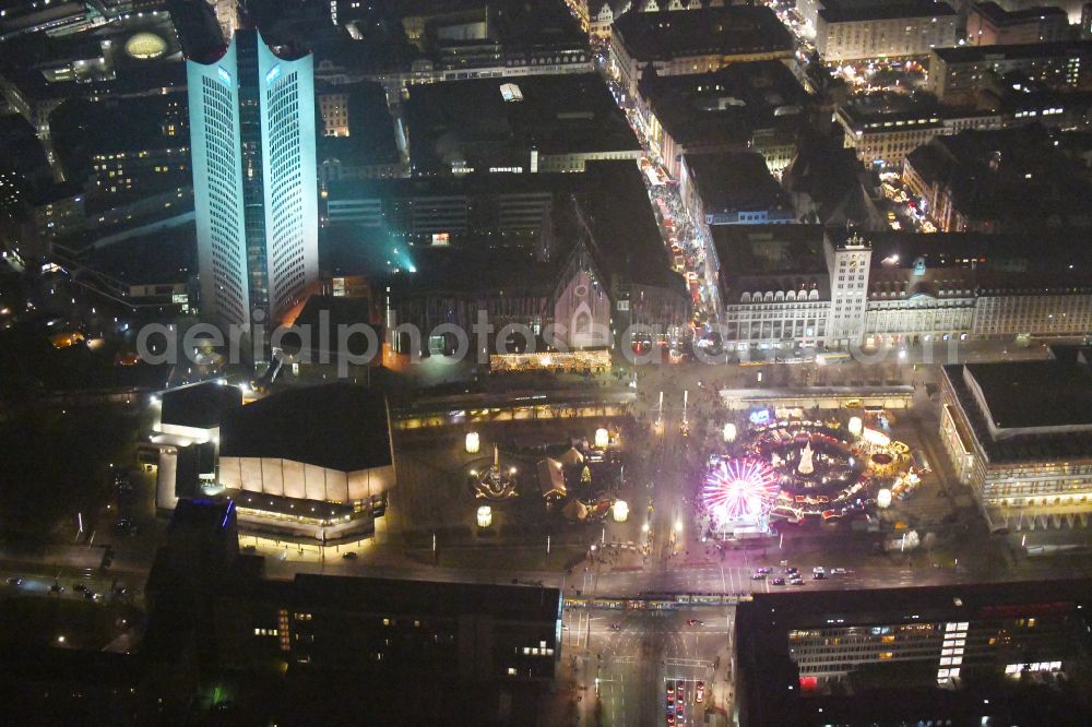 Leipzig at night from the bird perspective: Night lighting Christmassy market event grounds and sale huts and booths on Augustusplatz in Leipzig in the state Saxony, Germany