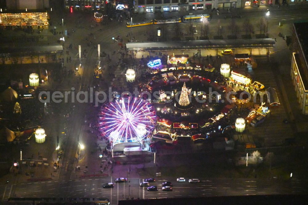 Aerial photograph at night Leipzig - Night lighting Christmassy market event grounds and sale huts and booths on Augustusplatz in Leipzig in the state Saxony, Germany