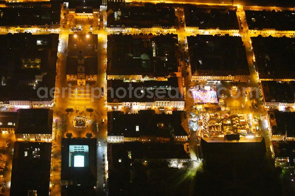 Aerial image at night Erlangen - Night lighting Christmassy market event grounds and sale huts and booths Erlanger Waldweihnacht in the district Bruck in Erlangen in the state Bavaria, Germany