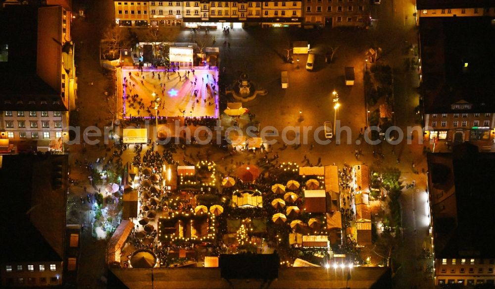 Erlangen at night from the bird perspective: Night lighting Christmassy market event grounds and sale huts and booths Erlanger Waldweihnacht in the district Bruck in Erlangen in the state Bavaria, Germany