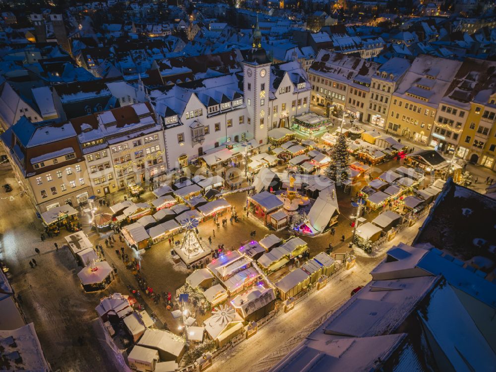 Aerial image at night Freiberg - Night lighting christmassy market event grounds and sale huts and booths on street Obermarkt in the district Altstadt in Freiberg in the state Saxony, Germany