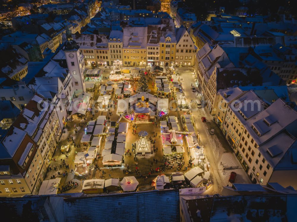 Freiberg at night from above - Night lighting christmassy market event grounds and sale huts and booths on street Obermarkt in the district Altstadt in Freiberg in the state Saxony, Germany