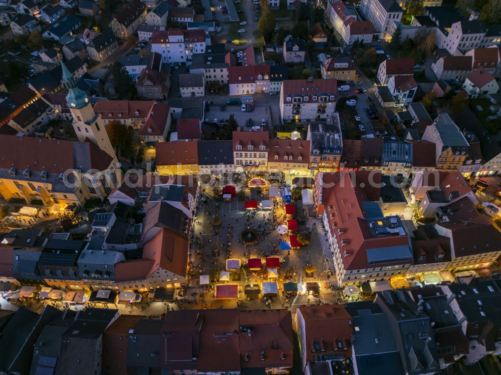 Pulsnitz at night from above - Night lighting christmassy market event grounds and sale huts and booths Pfefferkuchenmarkt on street Am Markt in Pulsnitz in the state Saxony, Germany