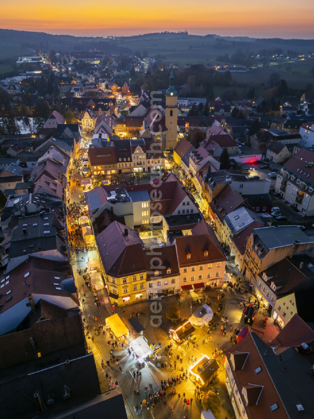 Pulsnitz at night from above - Night lighting christmassy market event grounds and sale huts and booths Pfefferkuchenmarkt on street Am Markt in Pulsnitz in the state Saxony, Germany