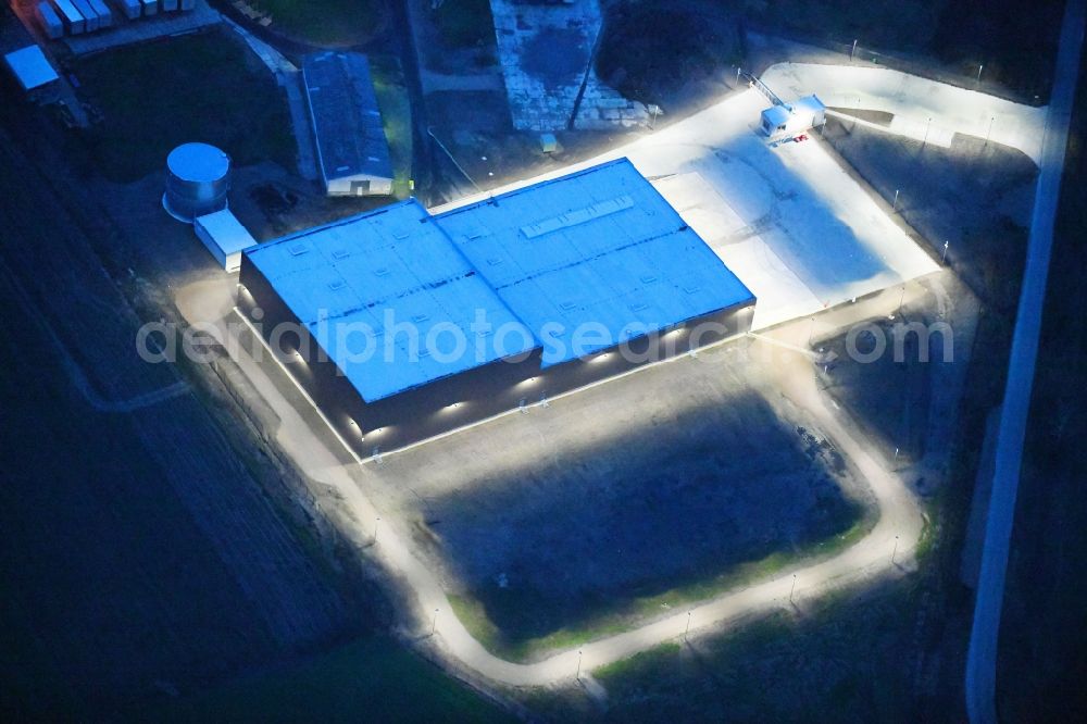 Aerial image at night Gardelegen - Night lighting Building and production halls on the premises of Carl Bechem GmbH on Kurze Strasse in the district Mieste in Gardelegen in the state Saxony-Anhalt, Germany