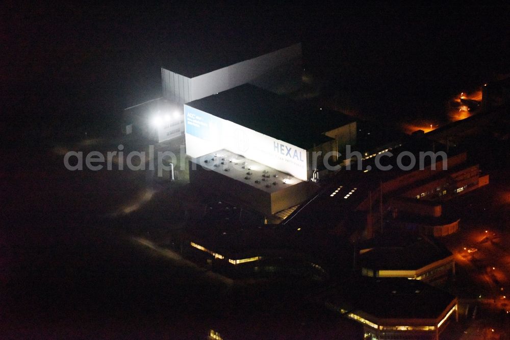 Aerial image at night Barleben - Night lighting Building and production halls on the premises of the chemical manufacturers Salutas Pharma GmbH an der Otto-von-Guericke-Allee in the district Suelzegrund in Barleben in the state Saxony-Anhalt