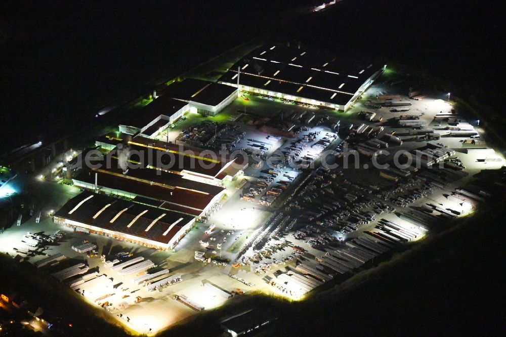 Niedere Börde at night from above - Night lighting Building and production halls on the premises Dachziegelwerke Nelskamp GmbH in Niedere Boerde in the state Saxony-Anhalt, Germany