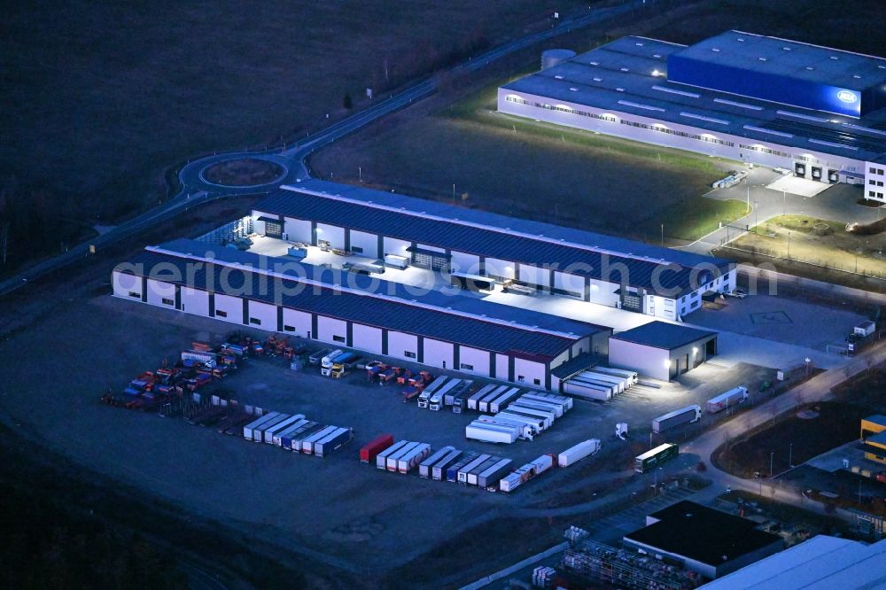 Aerial image at night Meiningen - Night lighting building and production halls on the premises of Feilmeier AG in Meiningen in the state Thuringia, Germany