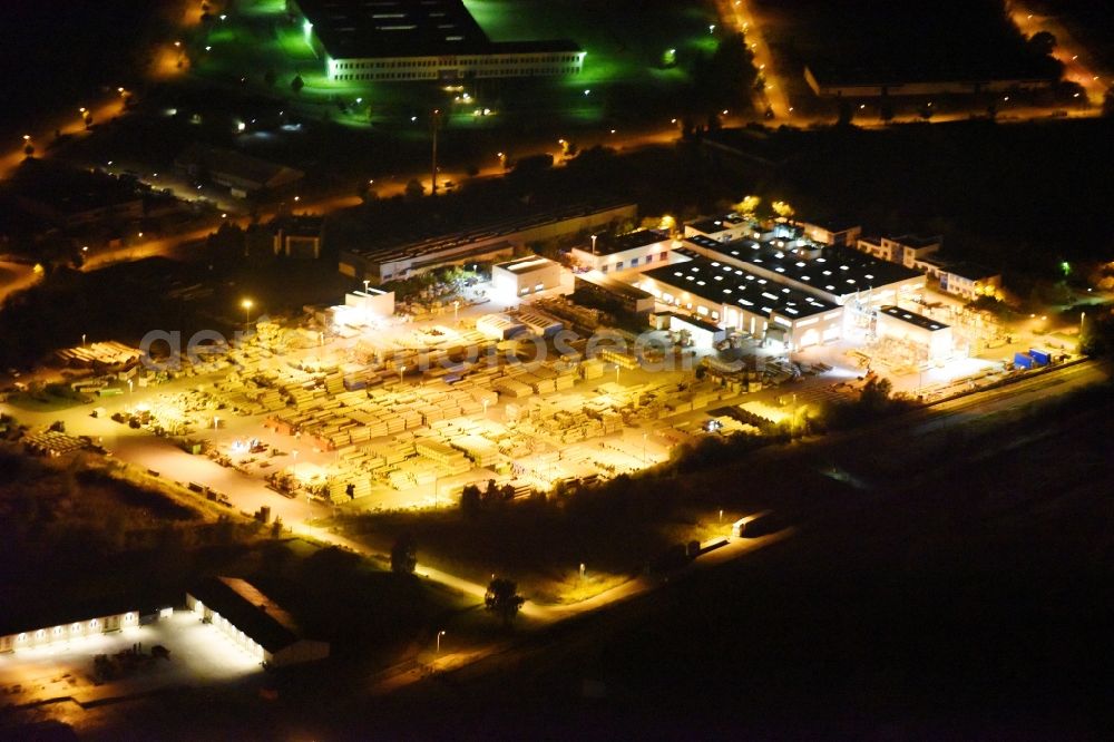 Aerial photograph at night Trollenhagen - Night lighting Building and production halls on the premises of of Hobas Rohre GmbH on Gewerbepark in Trollenhagen in the state Mecklenburg - Western Pomerania, Germany