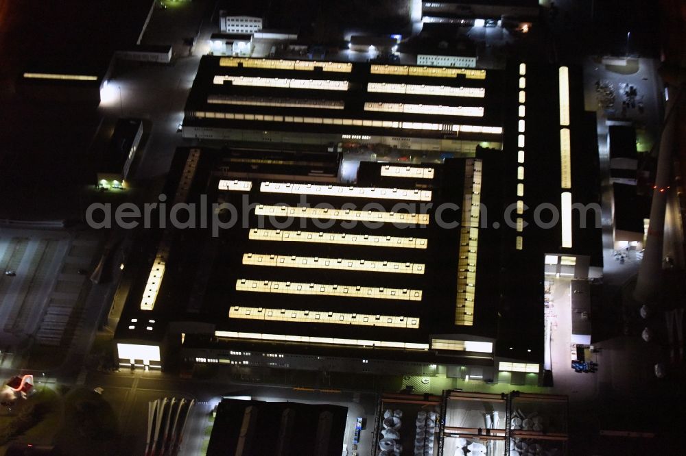 Magdeburg at night from the bird perspective: Night lighting premises of the wind turbine manufacturer ENERCON GmbH in Magdeburg in Saxony-Anhalt