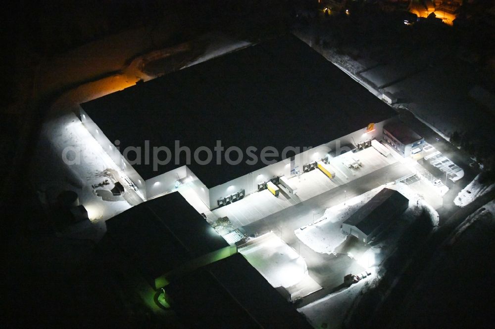 Aerial photograph at night Tanna - Night lighting Building and production halls on the premises of Geis Industrie-Service GmbH in the district Seubtendorf in Tanna in the state Thuringia, Germany