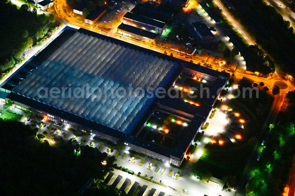 Berlin at night from above - Night lighting building and production halls on the premises of HASSE & WREDE GmbH on Georg-Knorr-Strasse in the district Marzahn in Berlin, Germany