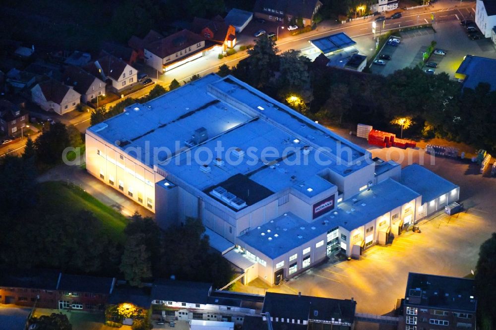 Dissen am Teutoburger Wald at night from above - Night lighting Building and production halls on the premises of Homann Feinkost GmbH in Dissen am Teutoburger Wald in the state Lower Saxony, Germany