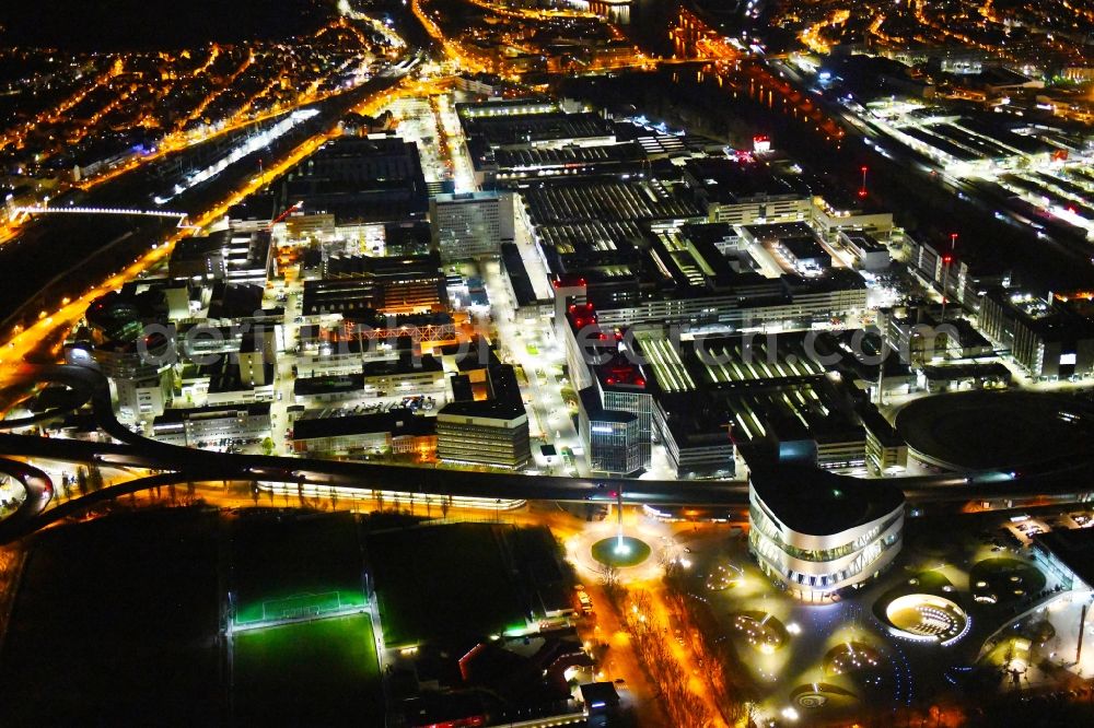 Aerial image at night Stuttgart - Night lighting building and production halls on the premises of Merceof-Benz Nieoflassung on Ufer of Neckar in the district Untertuerkheim in Stuttgart in the state Baden-Wurttemberg, Germany