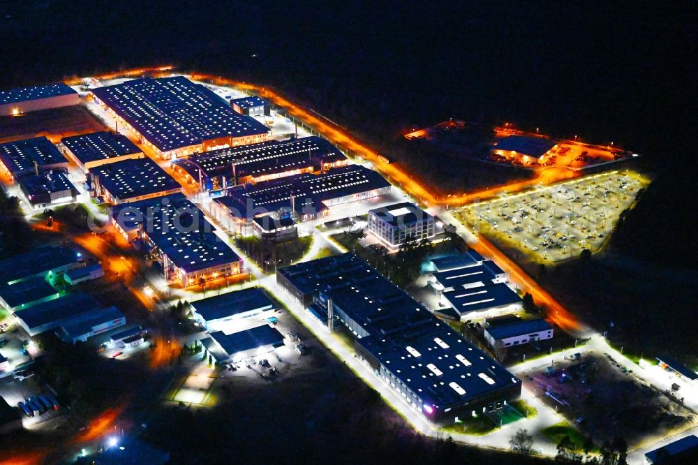 Oranienburg at night from above - Night lighting building and production halls on the premises of ORAFOL Europe GmbH on Orafolstrasse in Oranienburg in the state Brandenburg, Germany