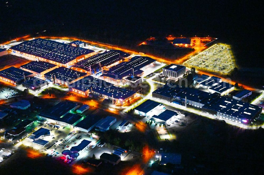 Aerial photograph at night Oranienburg - Night lighting building and production halls on the premises of ORAFOL Europe GmbH on Orafolstrasse in Oranienburg in the state Brandenburg, Germany