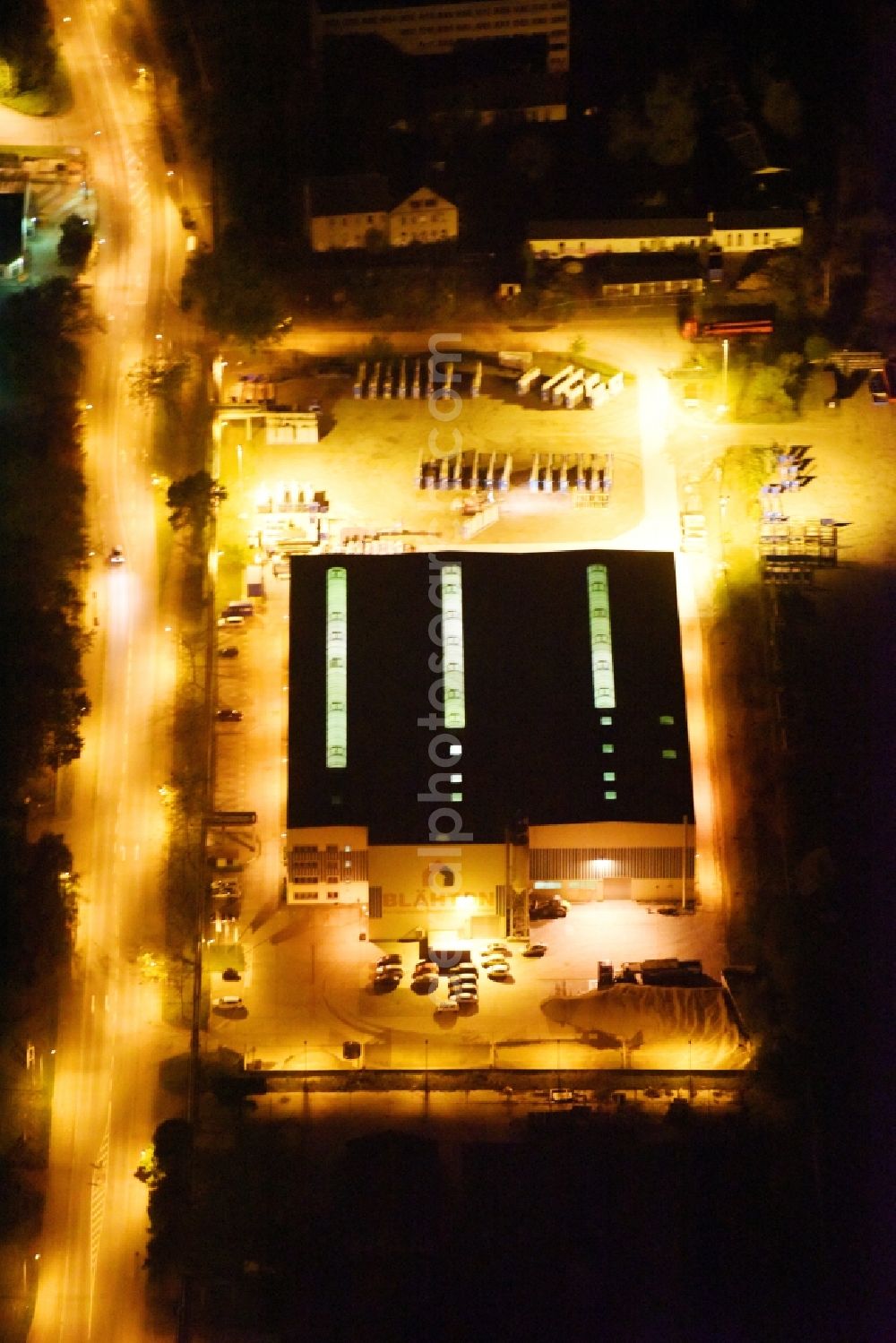 Aerial image at night Neubrandenburg - Night lighting Building and production halls on the premises of Praefa GmbH NL Blaehton Fertigteilwerk on Ihlenfelder Strasse in Neubrandenburg in the state Mecklenburg - Western Pomerania, Germany