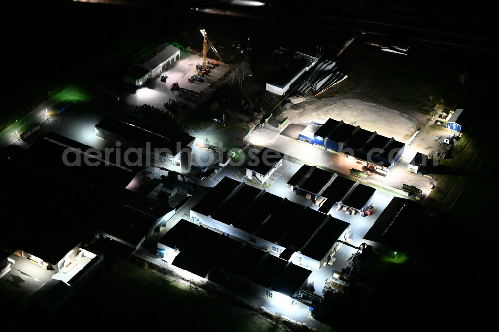 Heideland at night from above - Night lighting building and production halls on the premises of RASMUS GmbH on street Schortentalstrasse in Heideland in the state Thuringia, Germany