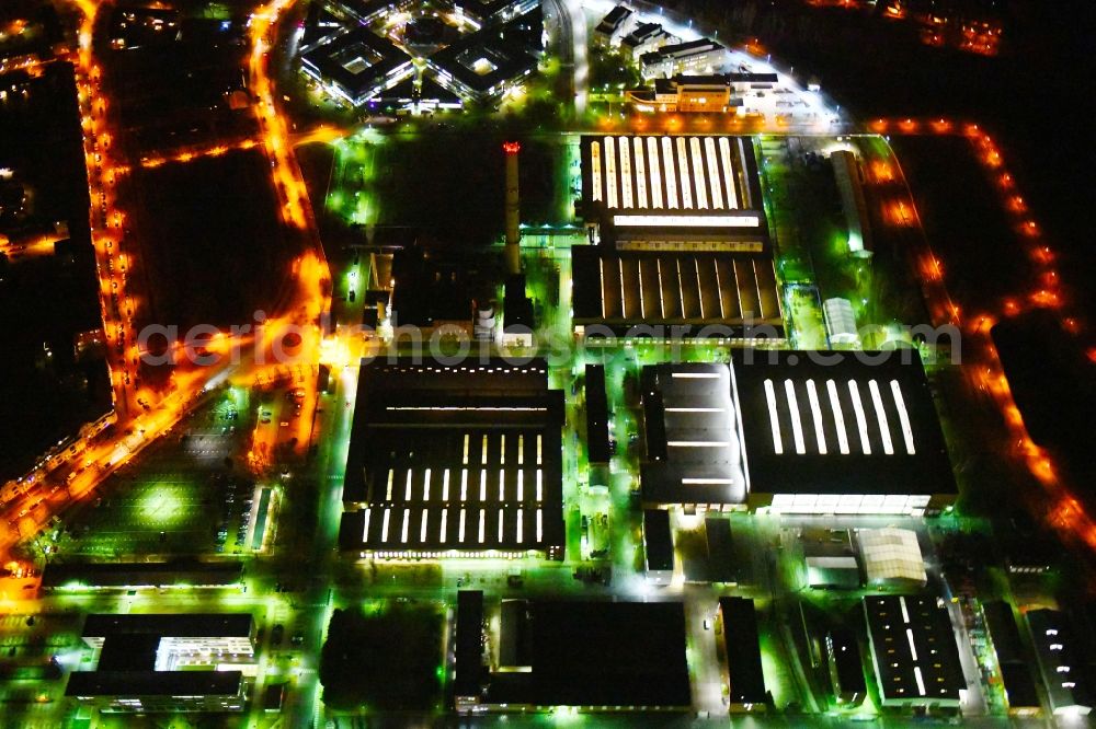 Aerial image at night Hennigsdorf - Night lighting Building and production halls on the premises on Rathenaupark - Technologiepark in Hennigsdorf in the state Brandenburg, Germany