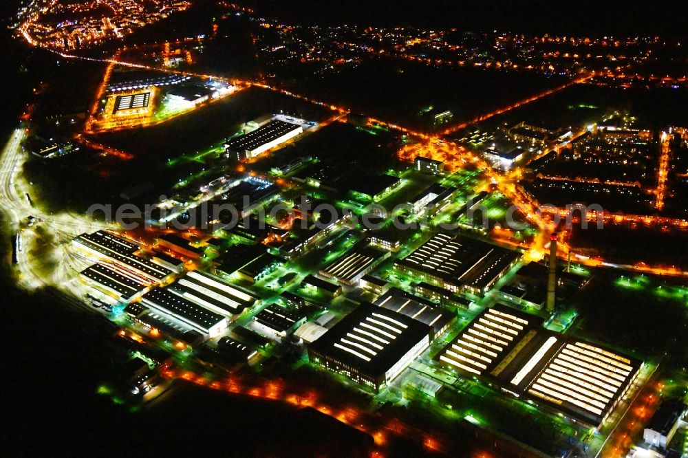 Aerial image at night Hennigsdorf - Night lighting Building and production halls on the premises on Rathenaupark - Technologiepark in Hennigsdorf in the state Brandenburg, Germany