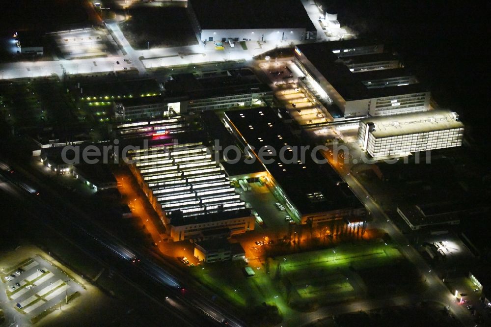 Aerial photograph at night Forchheim - Night lighting Building and production halls on the premises of Siemens Healthineers on Siemensstrasse in Forchheim in the state Bavaria, Germany