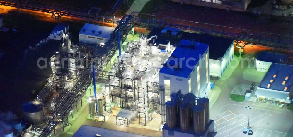 Aerial image at night Piesteritz - Night lighting refinery equipment and management systems on the factory premises of the chemical manufacturers of SKW Stickstoffwerke Piesteritz GmbH in Piesteritz in the state Saxony-Anhalt, Germany