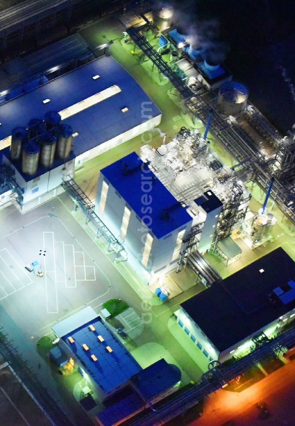 Aerial image at night Piesteritz - Night lighting refinery equipment and management systems on the factory premises of the chemical manufacturers of SKW Stickstoffwerke Piesteritz GmbH in Piesteritz in the state Saxony-Anhalt, Germany